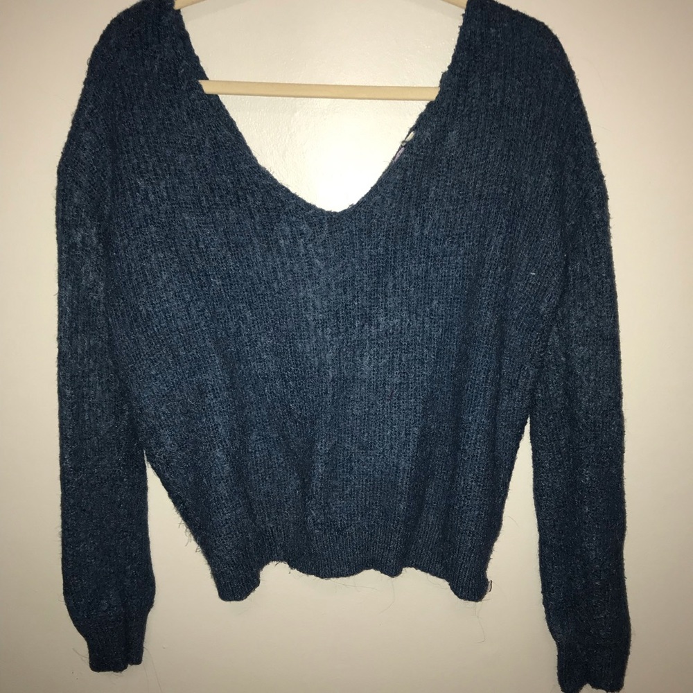 Blue fuzzy sweater with twist knot